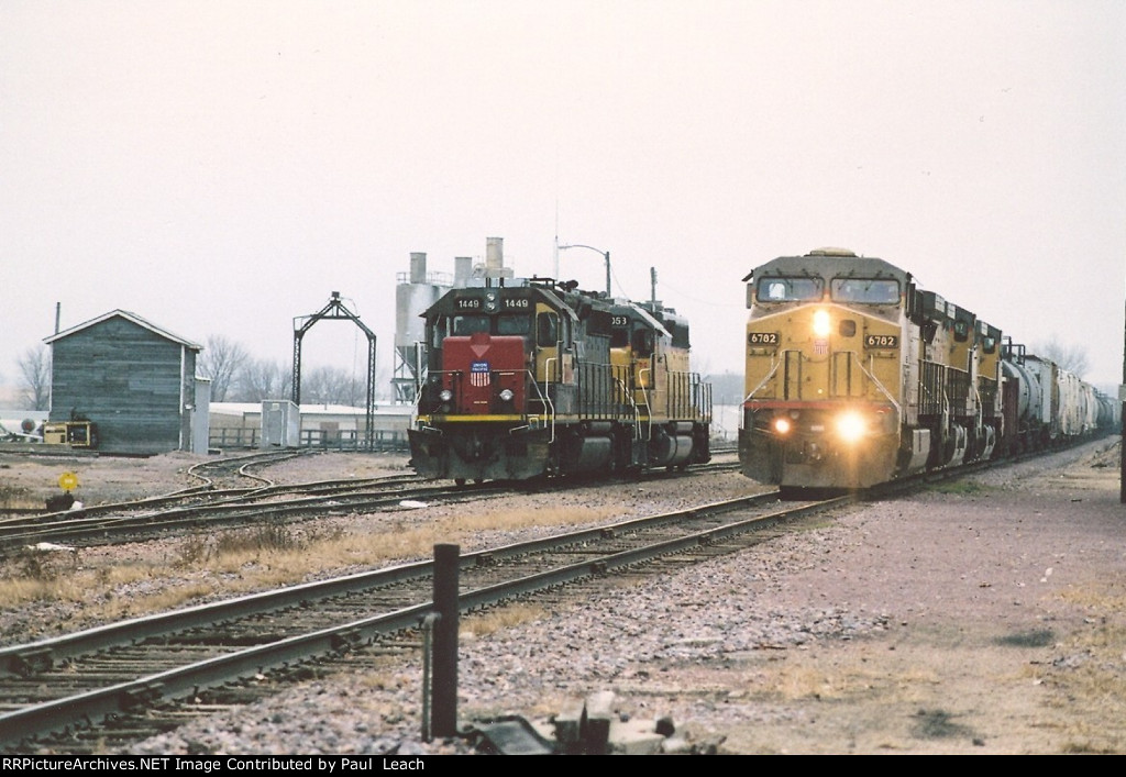 Eastbound manifest passes local power near the turntable